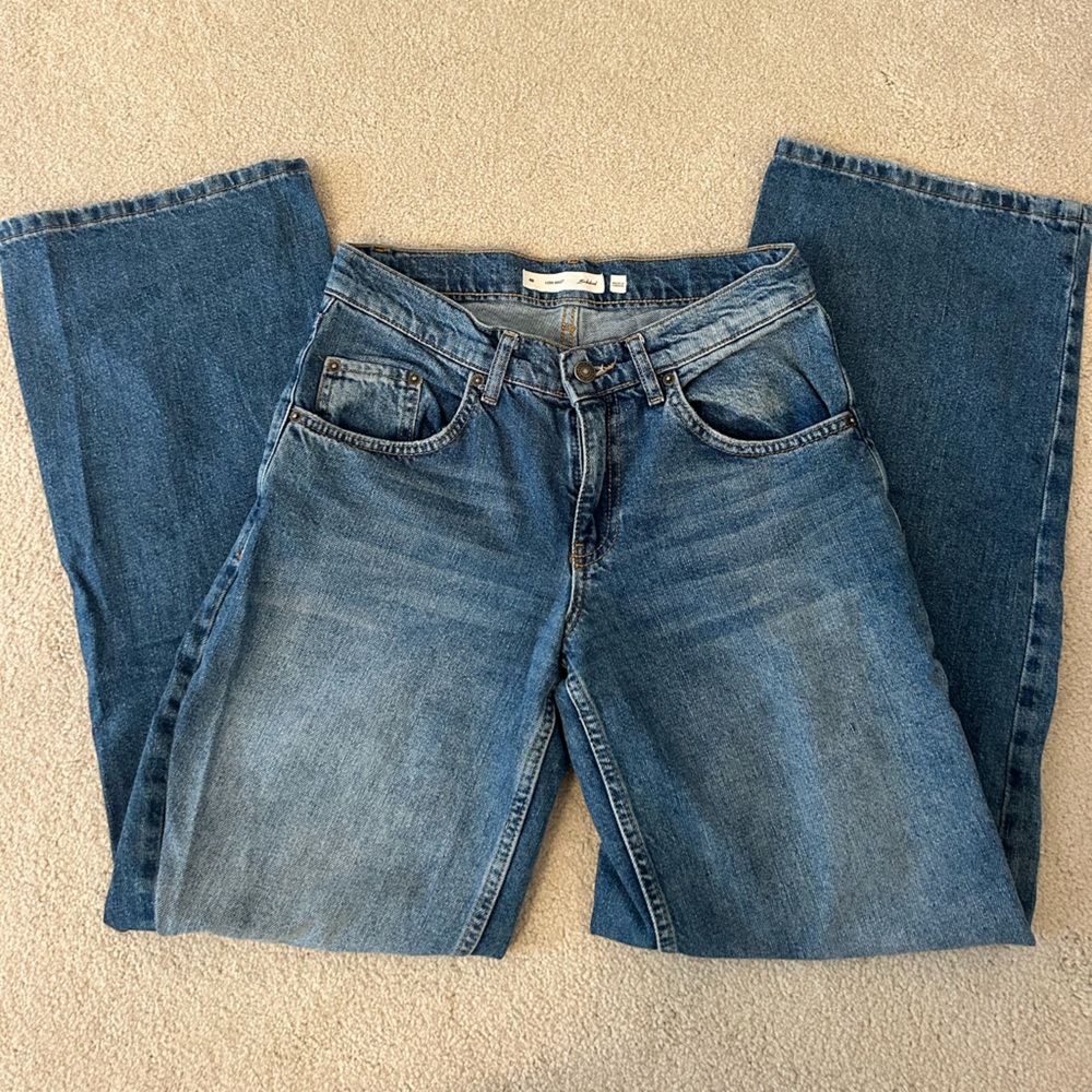 Subdued low rise, wide leg jeans